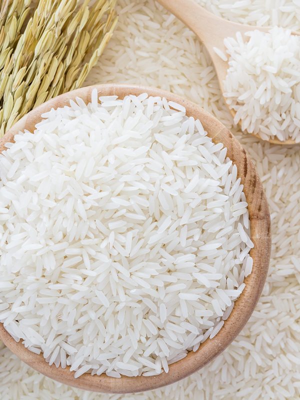 white-rice-bowl-bag-wooden-spoon-rice-plant-white-rice-background.jpg